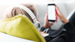 Woman couch headphones yellow jacket - a yellow jacket free wallpaper