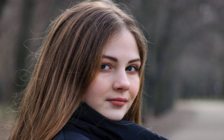 Woman longhair blackjacket serious blueeyes - a black jacket free wallpaper for desktop