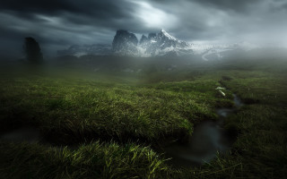 Grassy field stream cloudy mountains - a grassy field free wallpaper