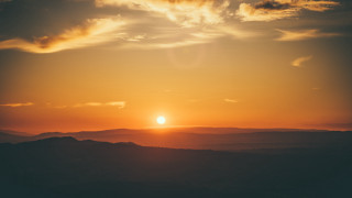 Sunset clouds hills ocean reflection - a few hill free wallpaper