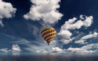 Hot air balloon ocean cloudy - a hot air balloon free wallpaper