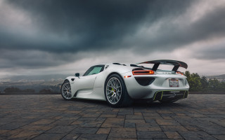 White sports car cloudy sky 2 - a white sports car free wallpaper