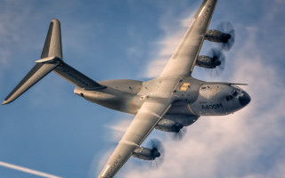 Large airplane blue sky clouds - a large airplane free wallpaper