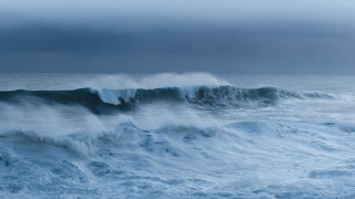 Stormy ocean wave surfing cloudy - a large wave free wallpaper