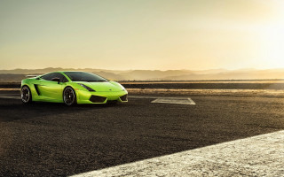 Green sports car desert sunset 2 - a road in the desert free wallpaper