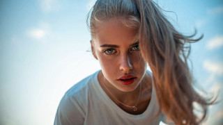 Woman ponytail serious portrait jewelry - her face and a necklace free wallpaper