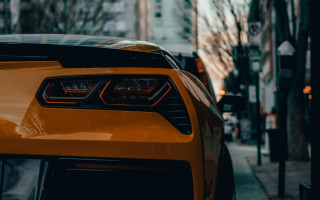 Yellow sports car city street 2 - a yellow sports car free wallpaper