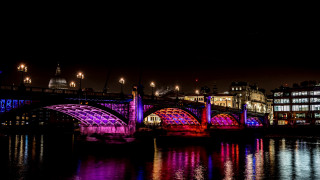 Lit bridge night cityscape reflection 2 - vibrant colour free wallpaper