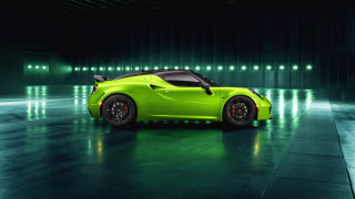 Green sports car dark room 5 - a green sports car free wallpaper