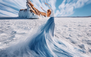 Woman blue dress snow outstretched - amir zand free wallpaper