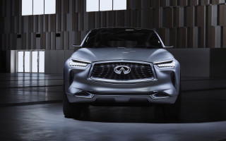 Silver infiniti concept car building - a large window behind free wallpaper