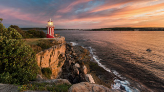Lighthouse cliff ocean sunset boat 3 - a cliff free wallpaper