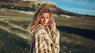 Woman blanket cellphone grass hill - cinematic photography free wallpaper