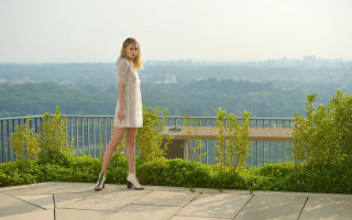 Woman balcony cityscape tree video - a balcony free wallpaper