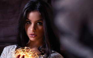 Woman holding lit item dark - item free wallpaper