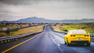 Yellow sports car country road 2 - a yellow sports car free wallpaper