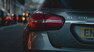 Car parked street anamorphic flare - a close up of a car free wallpaper