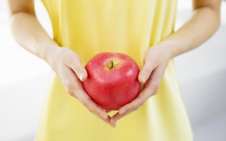 Woman yellow dress apple neoplasticism - both hand free wallpaper