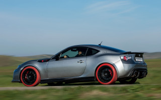 Silver sports car driving grass - andrew bell free wallpaper