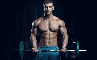 Muscular man barbell dark room - a muscular body free wallpaper