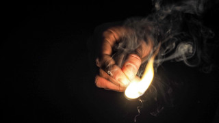 Hand lit cigarette smoke dark - free light wallpaper