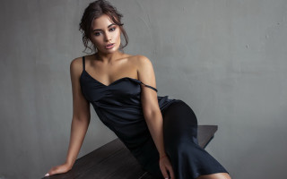 Woman black dress sitting table - fashion photoshoot free wallpaper