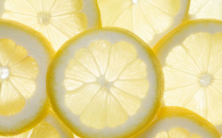 Lemon slice closeup tabletop background - lemon free wallpaper