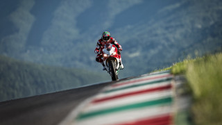 Motorcycle rider mountain road blurry - high free wallpaper