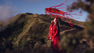 Woman red dress umbrella mountain - a red ribbon free wallpaper