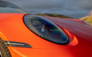 Red sports car cloudy sky 9 - a cloudy sky in the background free wallpaper