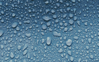 Water droplets blue surface black - a black border free wallpaper