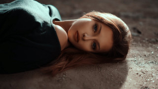 Woman laying on ground closed - her eye free wallpaper