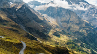 Winding mountain road cloudy sky - road free wallpaper