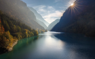 Lake mountains trees sunlight sky - light ray free wallpaper