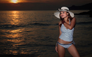 Beach sunset woman bikini hat - a woman in a bikini and hat free wallpaper