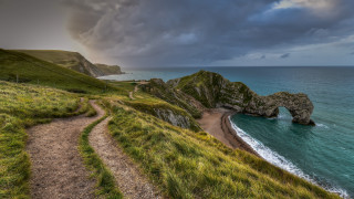Beach path large rock formation - a large rock formation free wallpaper