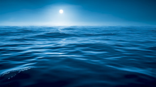 Ocean moonlight blue sky beach - a bright light in the middle of it free wallpaper