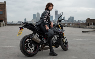 Eve ryder motorcycle city skyline - a city skyline in the background free wallpaper