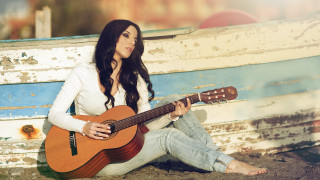 Woman sitting guitar beach sunset - a guitar free wallpaper
