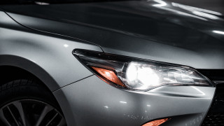 Car headlight black background white - a close up of a car free wallpaper