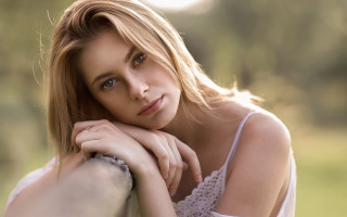 Woman leaning rail serious portrait - a rail free wallpaper