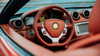 Red car showroom dashboard blurry - wheel and dashboard free wallpaper