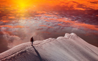 Mountain sunset cloudy sky figure - top of a snow free wallpaper