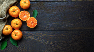 Oranges wooden table still life - a group of oranges free wallpaper