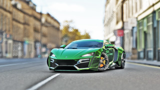 Green sports car city street - a green sports car free wallpaper