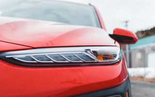 Red car snowy road building - sharp detail free wallpaper for desktop
