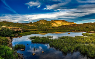 Lake mountains cloudy sky grass - mountain under a cloudy sky free wallpaper