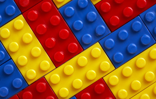 Lego closeup pattern colored red - complexity free wallpaper