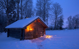 Cabin lit candle snow night - a cabin free wallpaper