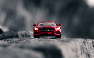 Red toy car rock tiltshift - tilt shift free wallpaper